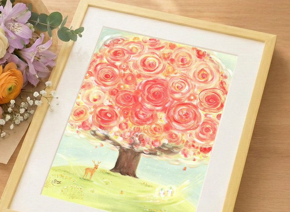 額に入れた絵画「いのちの樹」と花束